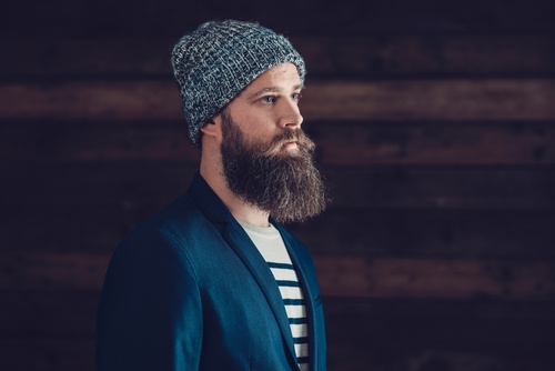 Side View of a Goatee Man with Bonnet Facing Right