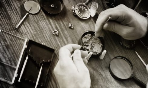 black and white photo watch clock repairing